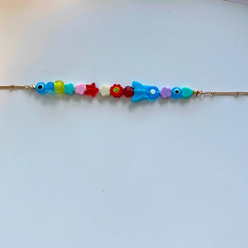 Multiple colored necklaces, kid/indie core